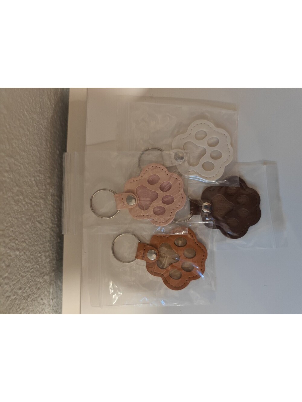 Set of 4 Leather Paw Print Keychains in Multiple Colors